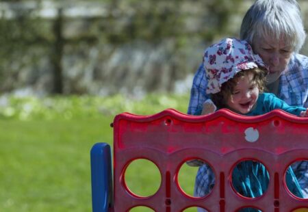 Grandma and granddaughter playing Connect Four