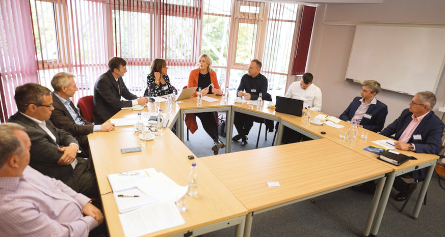 Business colleagues seated around a table in a meeting room at Dunston Innovation Centre