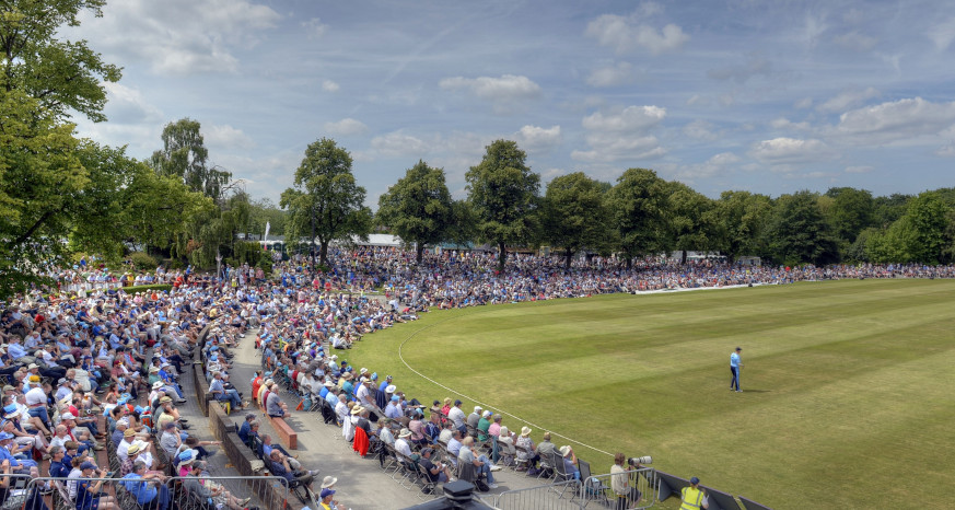 Crowds enjoying cricket at Queen's Park