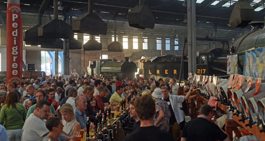 Visitors enjoying drinks and entertainment at the Rail Ale Festival