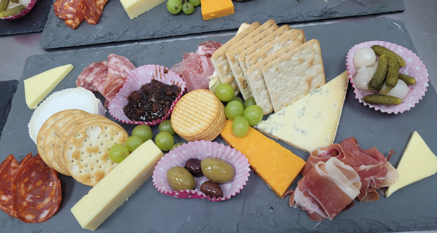 Charcuterie board with cheese and crackers