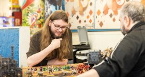 Friends playing games at Geeks Headquarters in Chesterfield town centre