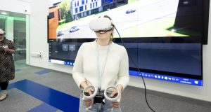 White female using virtual reality headset at Chesterfield College