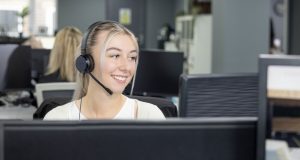 Female wearing headset at computer at Superior Wellness office, Chesterfield