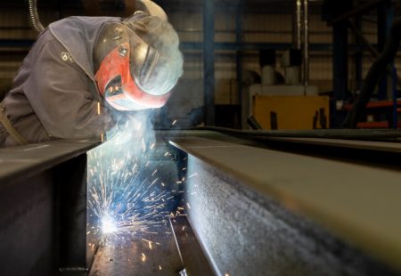 Engineer with protective gear at work at Weightron