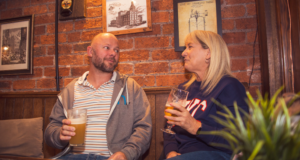 Female and male enjoying a pint at the Chesterfield Arms