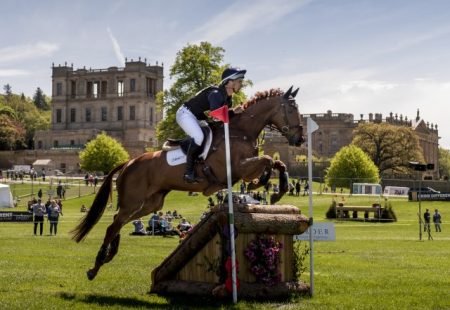 Chatsworth Horse Trials horse jumping over obstacle with house in background