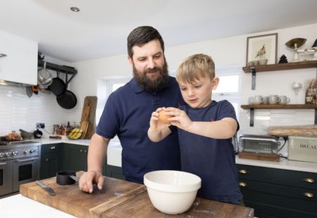 Father and sun in the kitchen baking