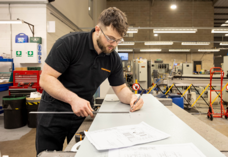 Apprentice working in the factory at Graphoidal
