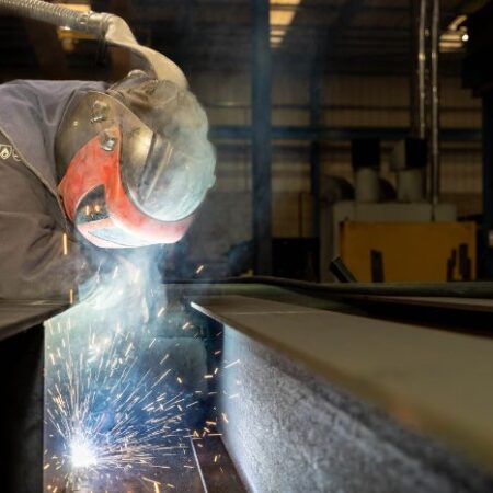 Person welding PPE and sparks