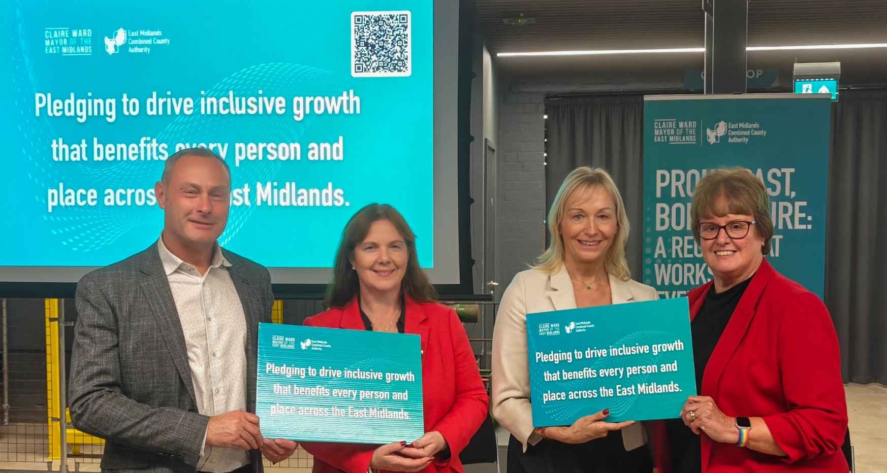 East Midlands Growth Strategy Launch at Derby Silk Mill. Andrew Byrne, Julie Richards and Cllr Tricia Gilby with East Midlands Mayor Claire Ward holding up pledge boards supporting the plan.