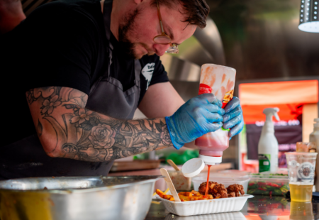 Food trader preparing food at The Great Chesterfield Feast