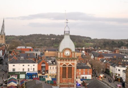 Birdseye view of Chesterfield market place with stalls, people and the Crooked Spire