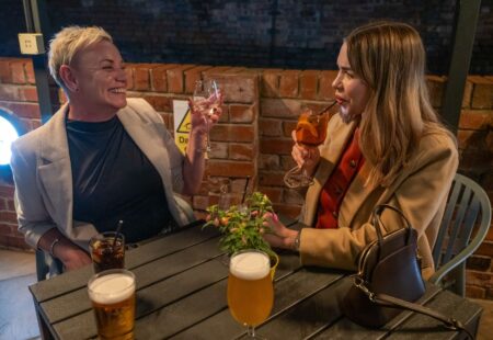 Friends socialising with drinks at Junction Bar