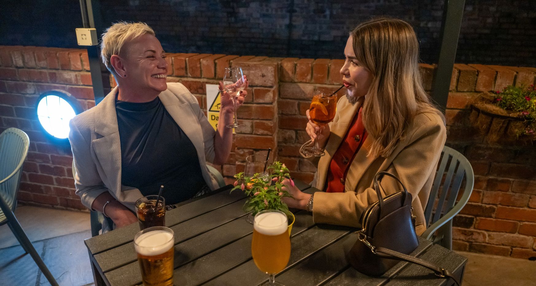 Friends socialising with drinks at Junction Bar