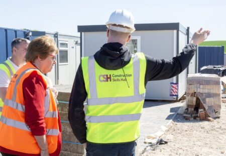 Matt Malkin, Cllr Gilby and a learner being given a tour of Construction Skills Hub