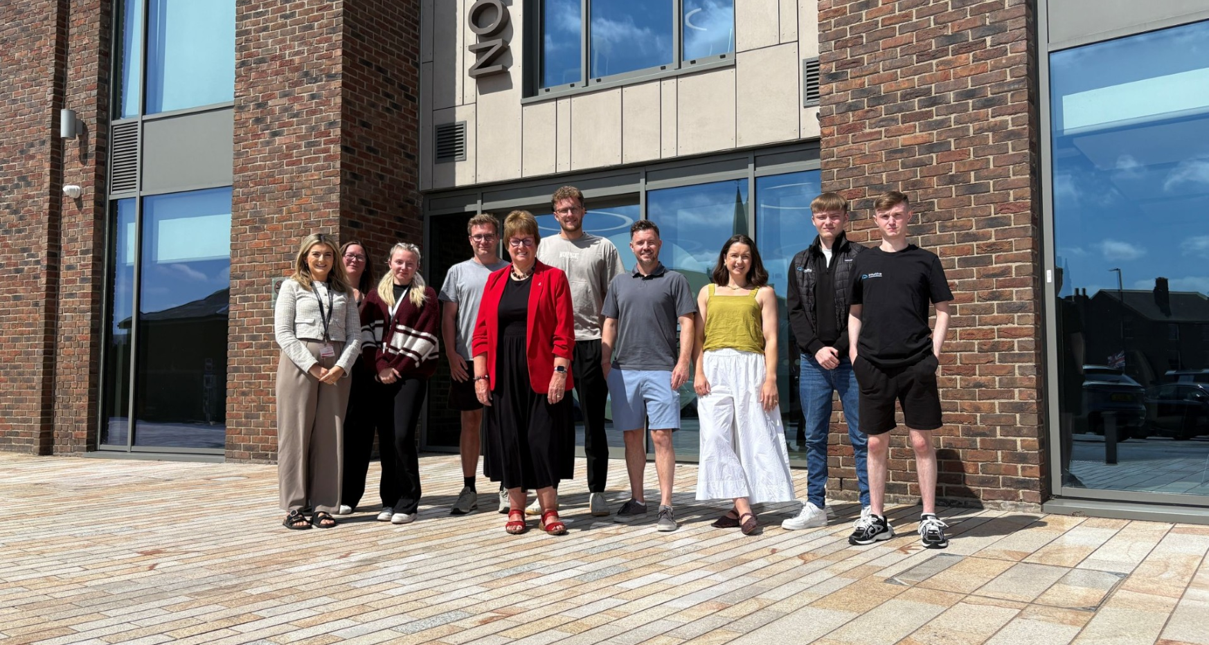 Cllr Tricia Gilby, with representatives from Nuzest, Best Solicitors, and Intuitive Infrastructure Solutions