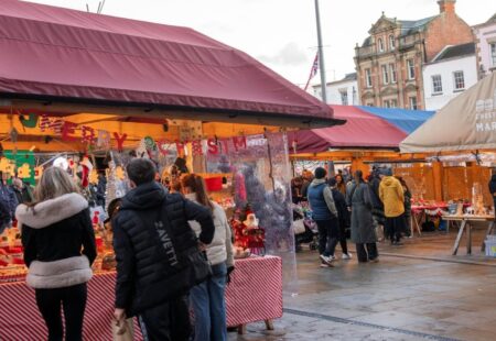 Visitors browsing stalls at Chesterfield Christmas Market