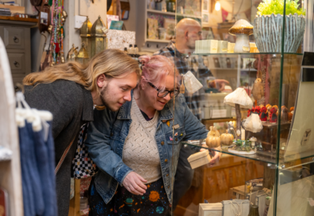 Two people browsing an independent shop.