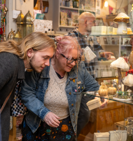 Two people browsing an independent shop.